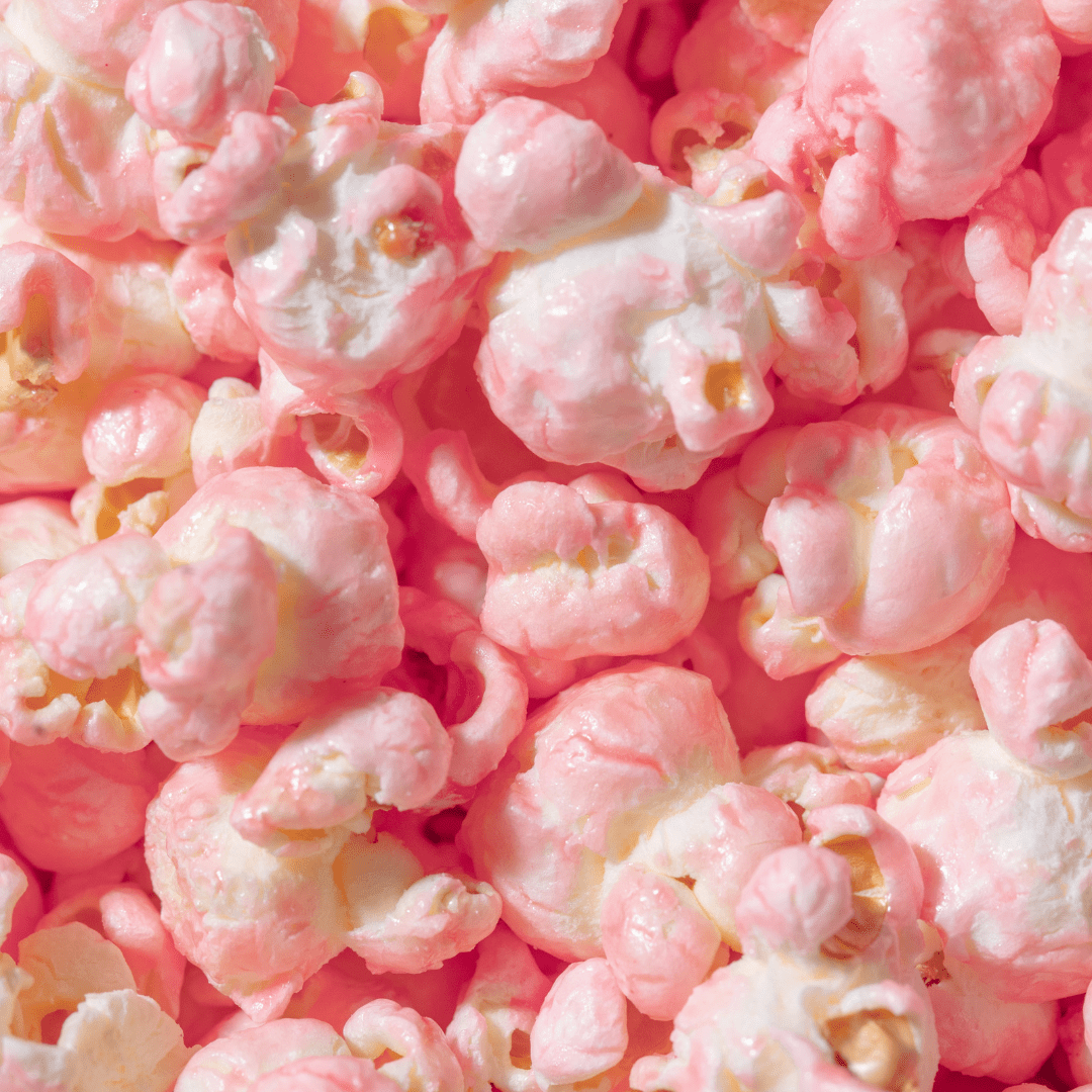 A close up of pink popcorn in a pile - Popcorn