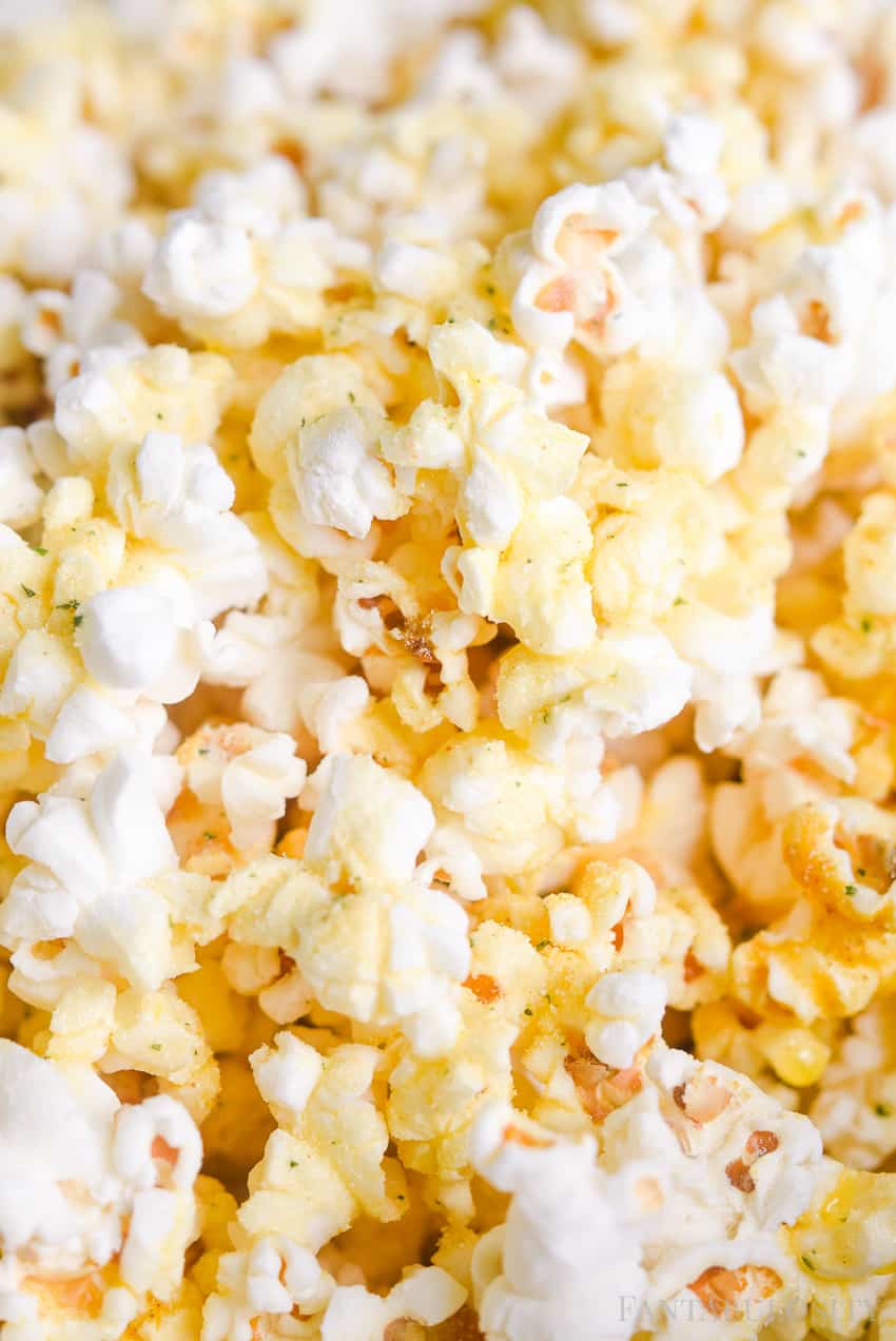 A close up of popcorn with ranch seasoning. - Popcorn