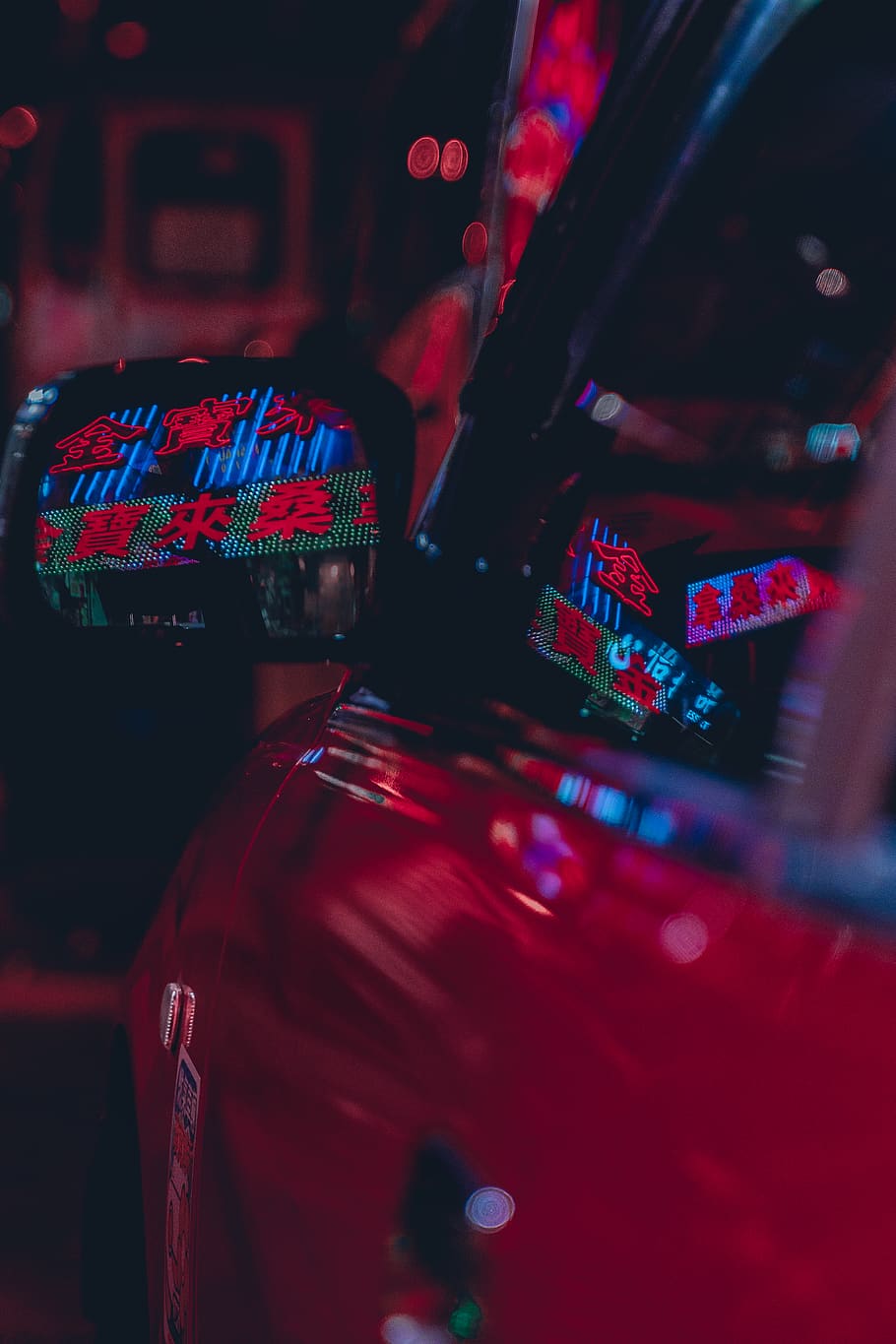 A red car with neon lights in the dark - Arcade