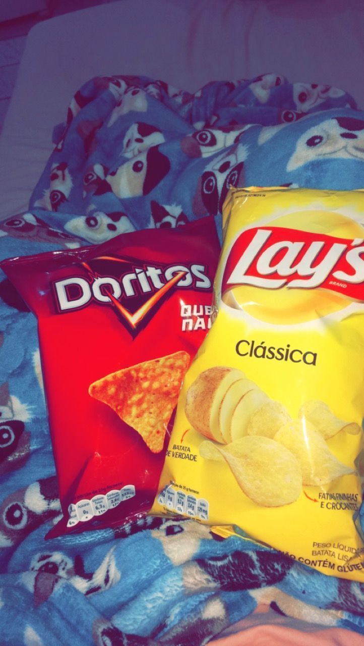 A bag of lays clasica chips next to a bag of doritos. - Doritos