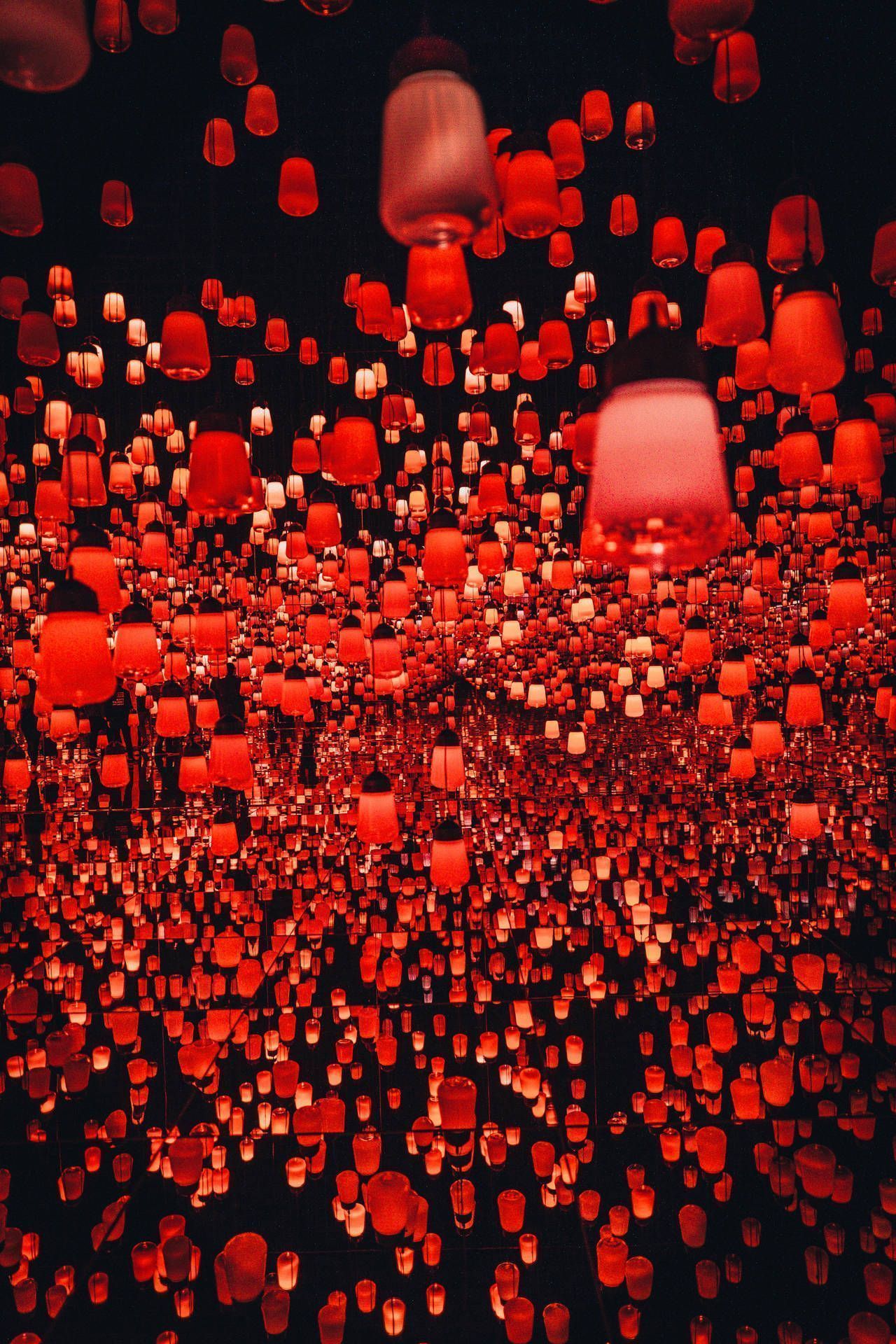 Red lanterns lit up on a black ceiling - Chinese