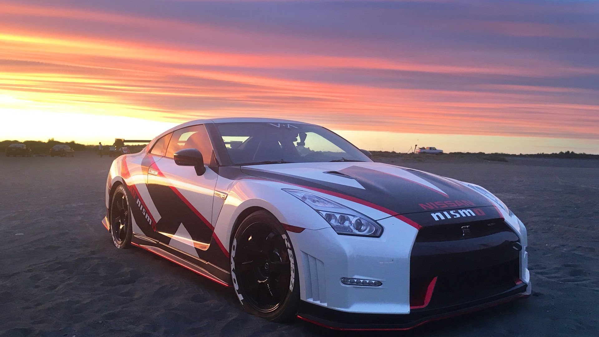 Nissan GTR at sunset on the beach - Nissan Skyline