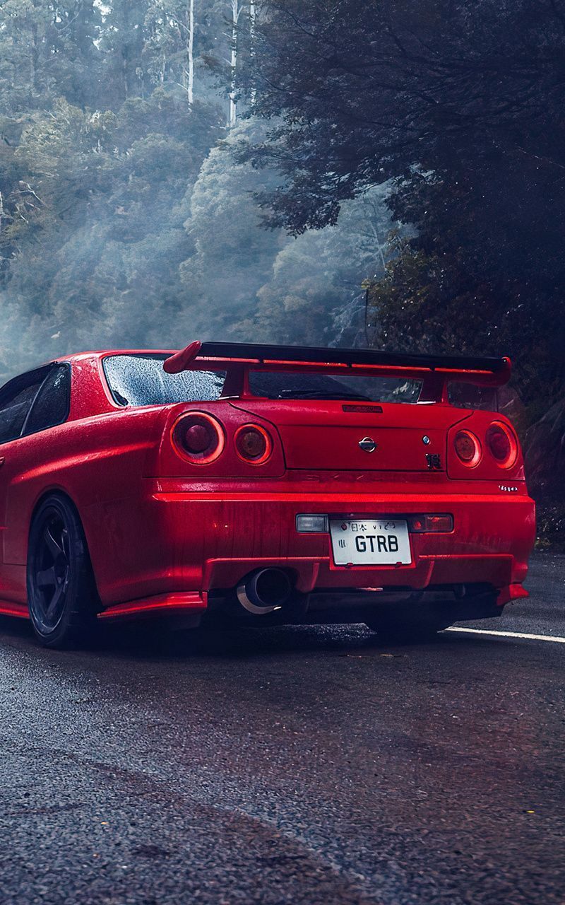 A red car with the license plate GTRB - Nissan Skyline