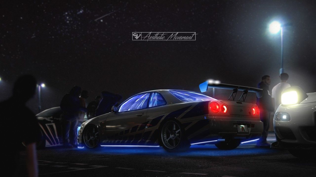 A Nissan Skyline R34 with blue lights on the back - Nissan Skyline