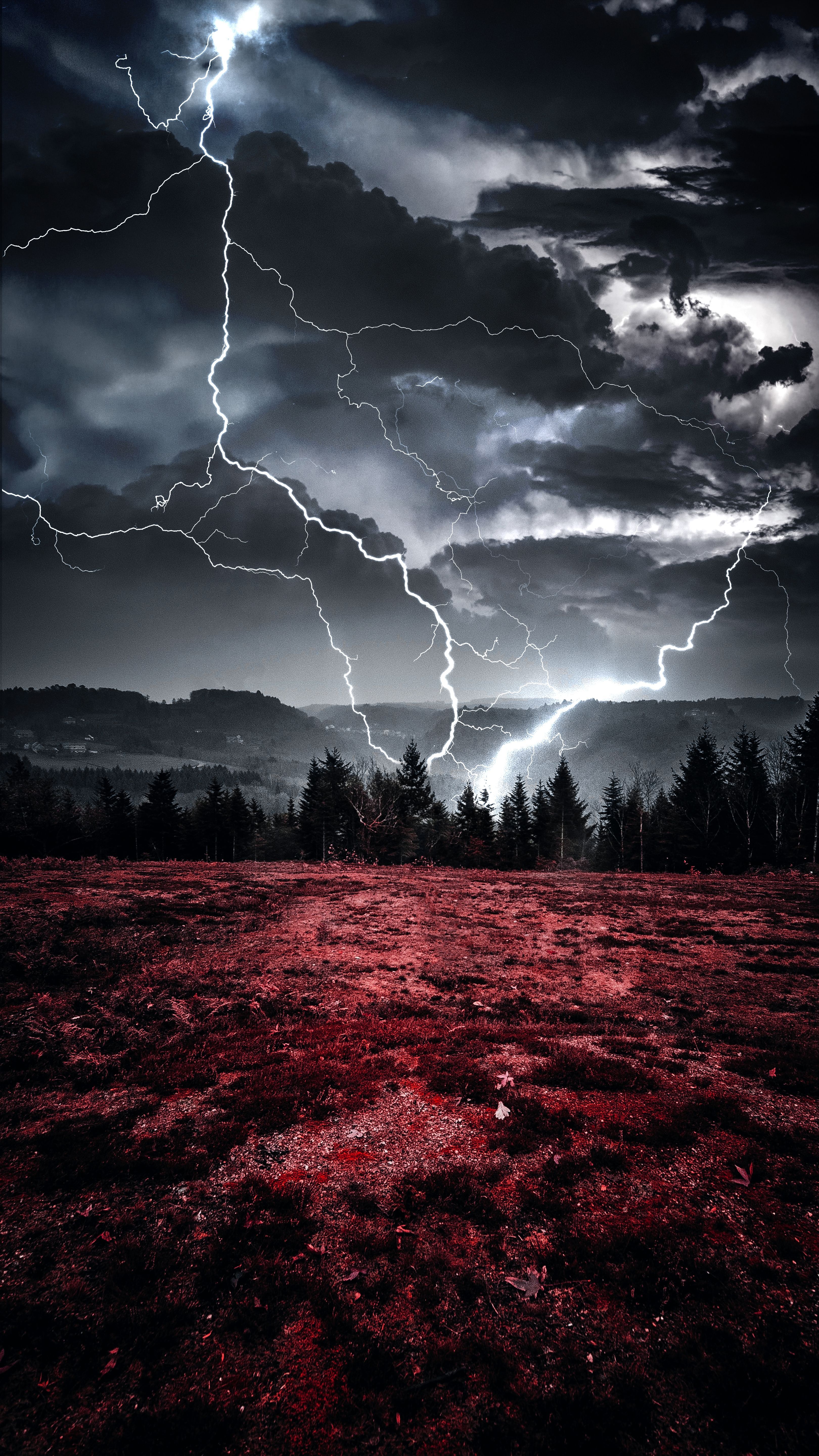 A red field with a dark sky and lightning - Lightning, storm