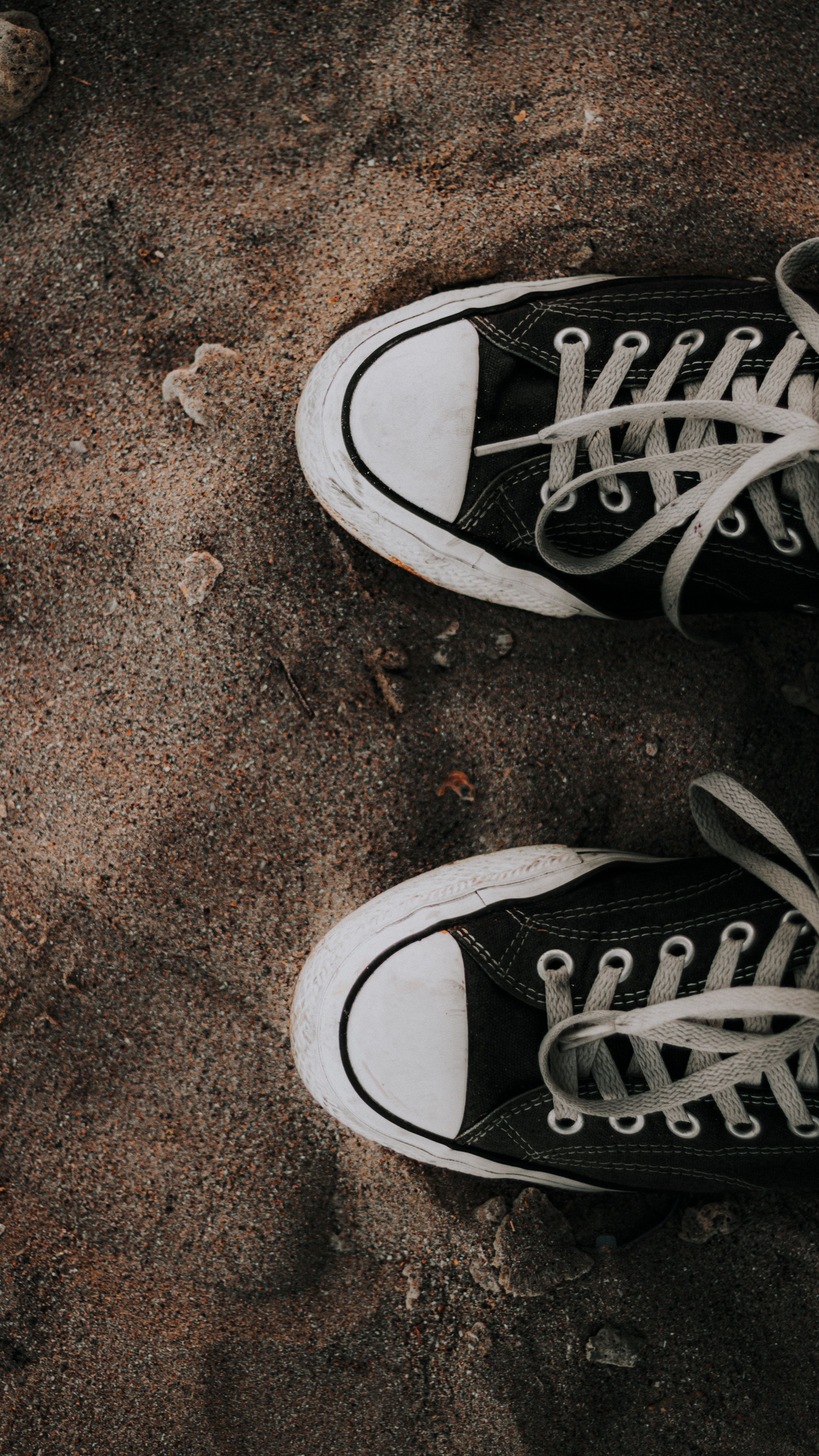 Dried Leaves on Top of the Black Converse Shoes · Free