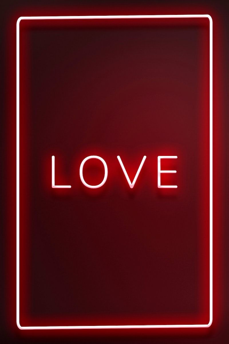 Red neon sign that says 'Love' - Neon red