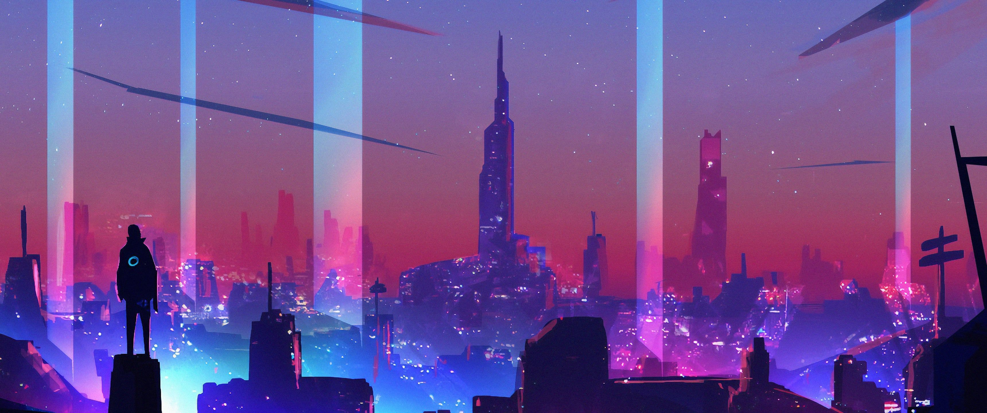 A person standing on a ledge looking out at a city lit up at night - 3440x1440