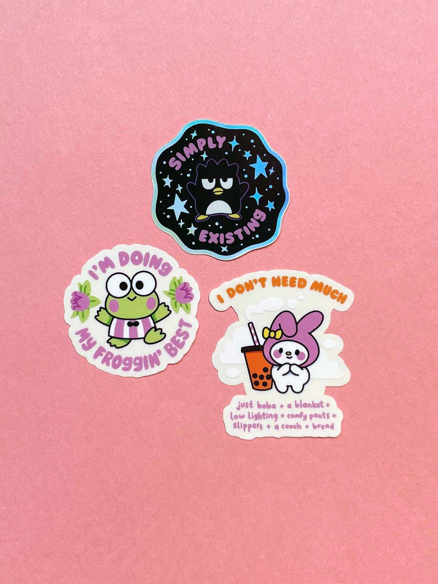 3 stickers on a pink background. One says 