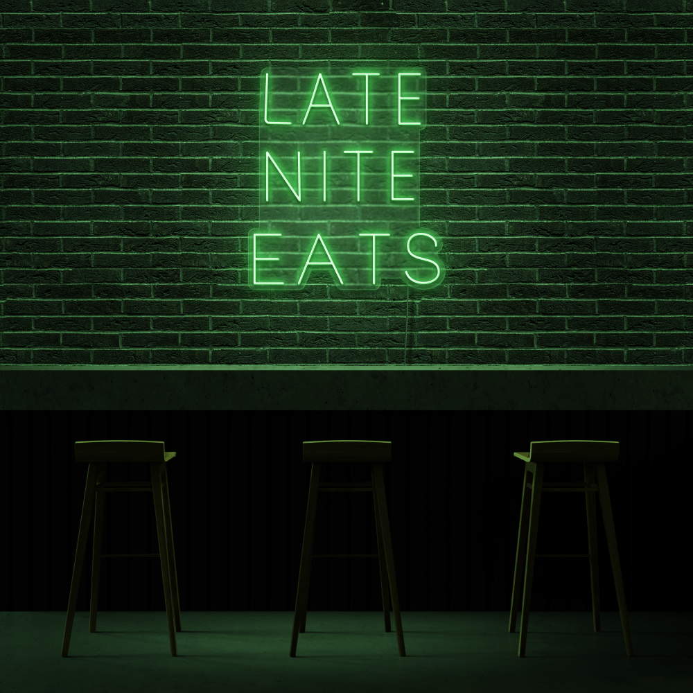 A neon sign that reads 'LATE NITE EATS' in green. - Neon green