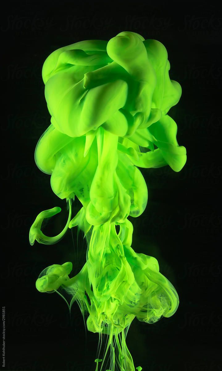 A green cloud of smoke against a black background - Neon green