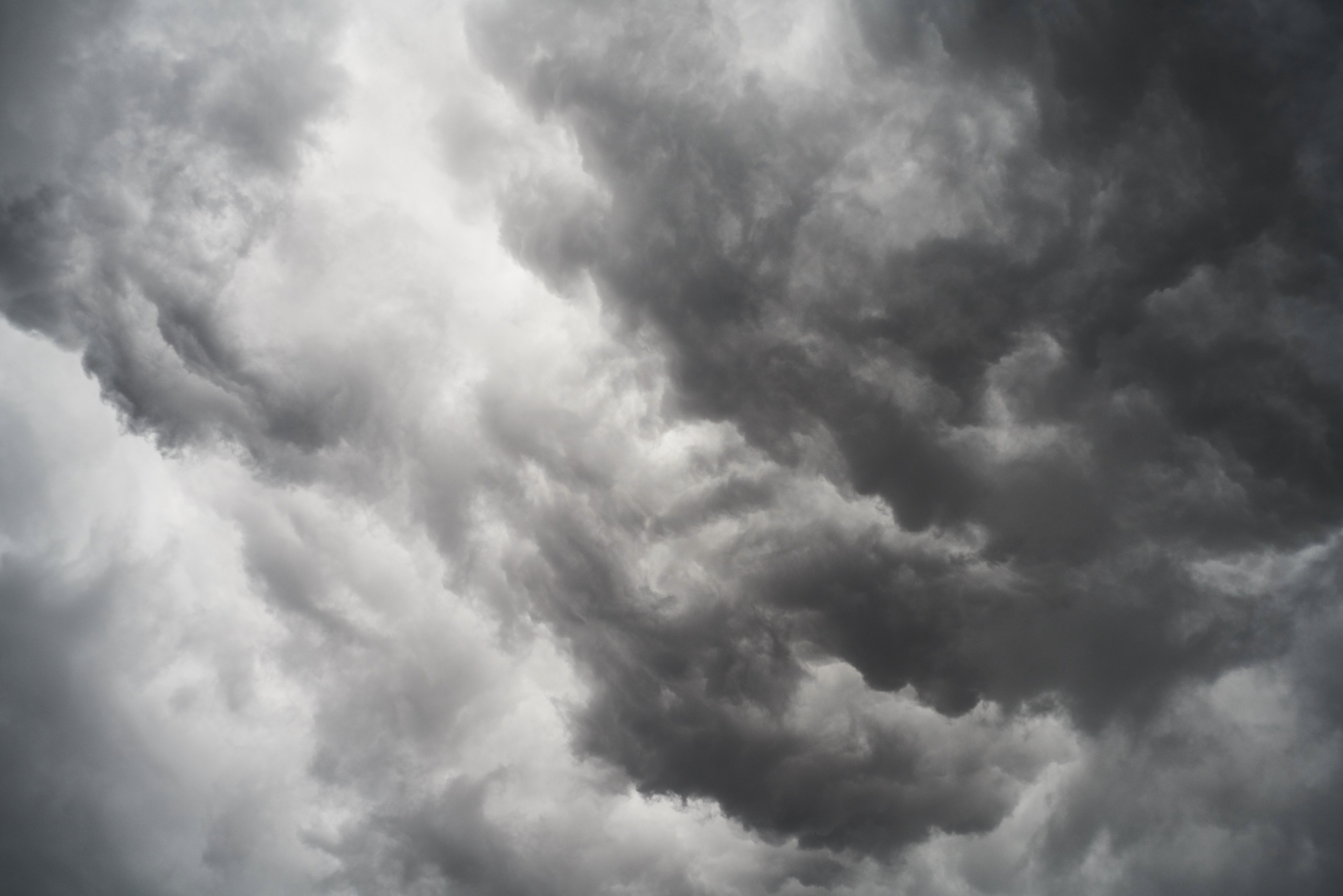 A photo of a dark and cloudy sky. - Gray