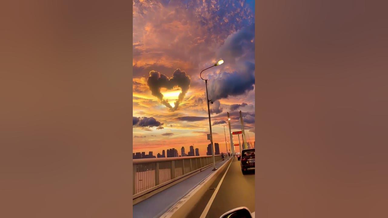 A heart-shaped cloud appears in the sky over the Golden Horn Bridge in Vladivostok, Russia - Seoul