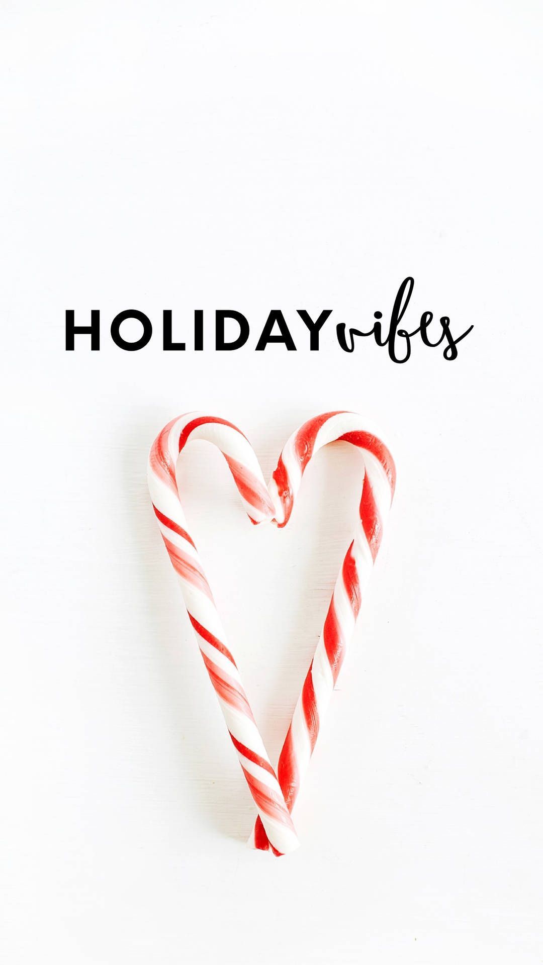 A candy cane with the words holiday vibes - Candy cane