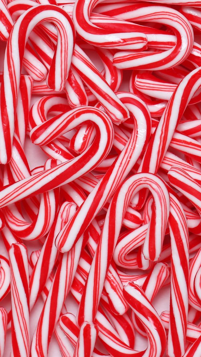 A pile of red and white candy canes - Candy cane