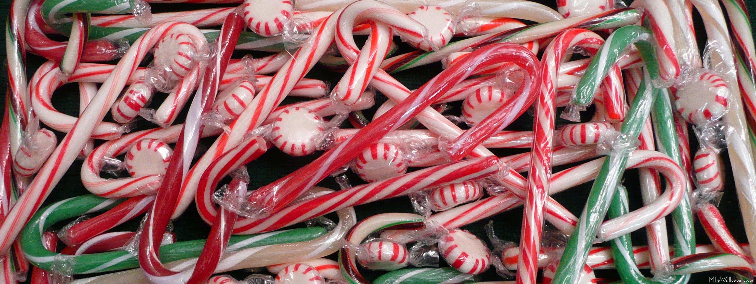 A close up of candy canes in plastic wrap - Candy cane