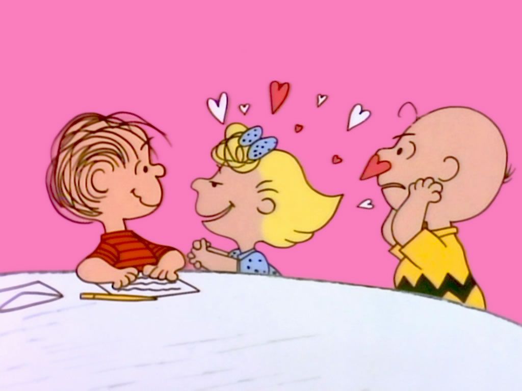 Charlie Brown, Linus, and Sally are sitting at a table with hearts around their heads - Charlie Brown