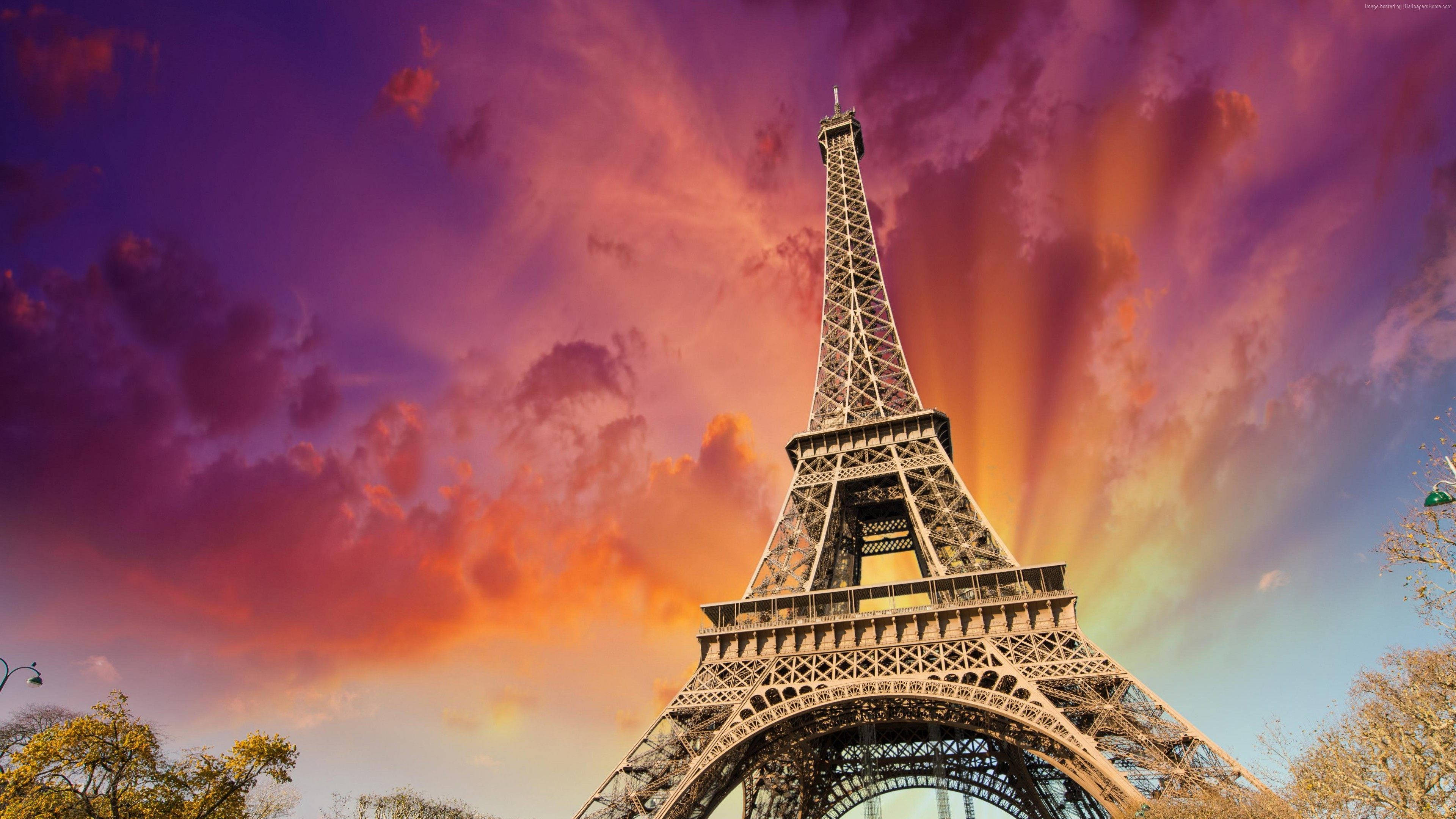 Download Eiffel Tower With Aesthetic Sun Rays Wallpaper