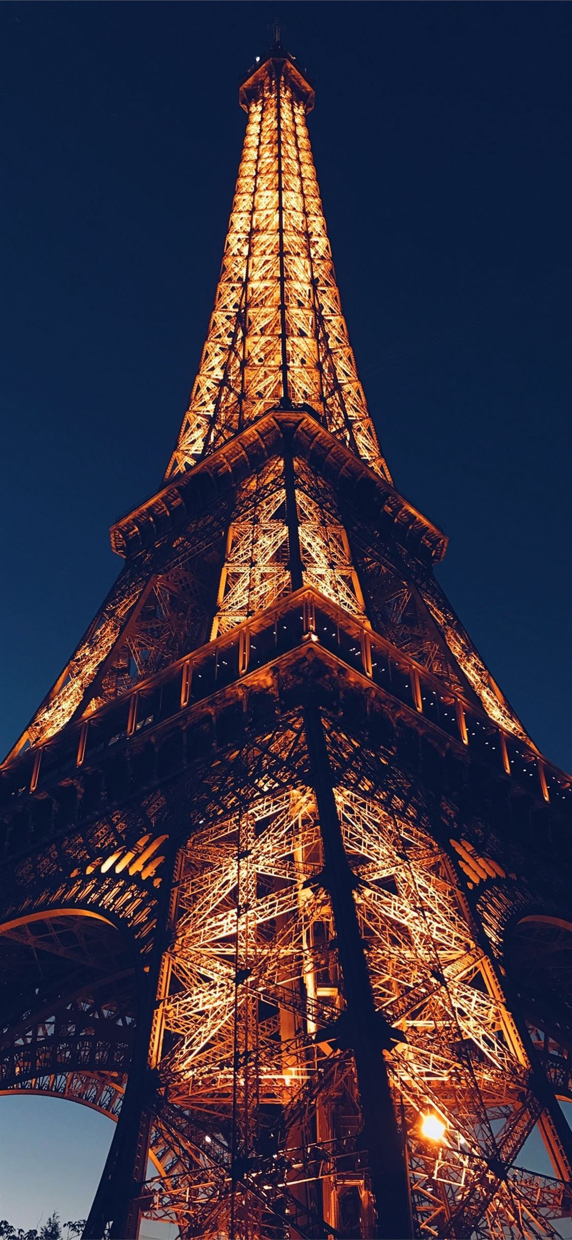 The eiffel tower is lit up at night - Eiffel Tower, architecture