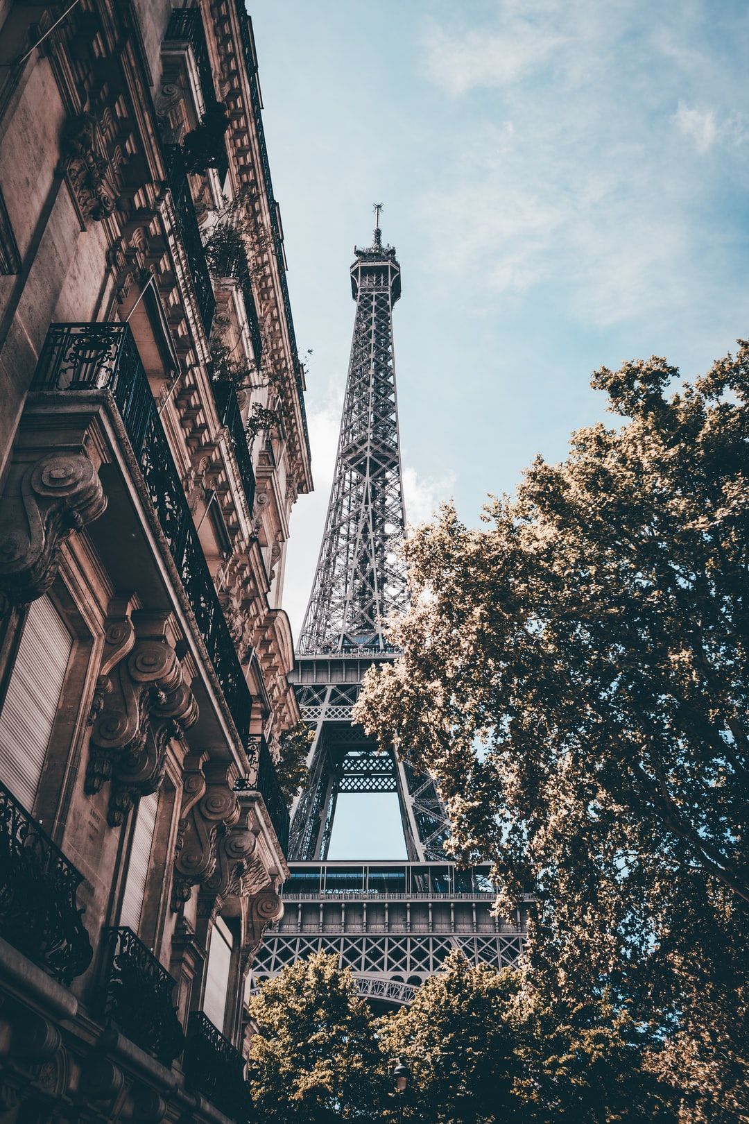 The eiffel tower is seen from a building - Eiffel Tower