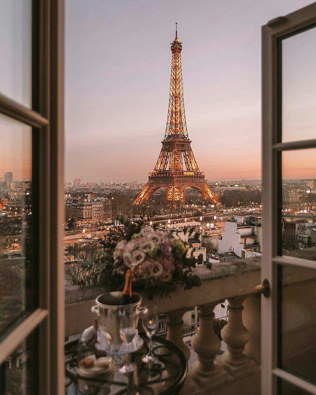 A balcony with champagne and flowers looking out to the Eiffel Tower - Eiffel Tower, Paris