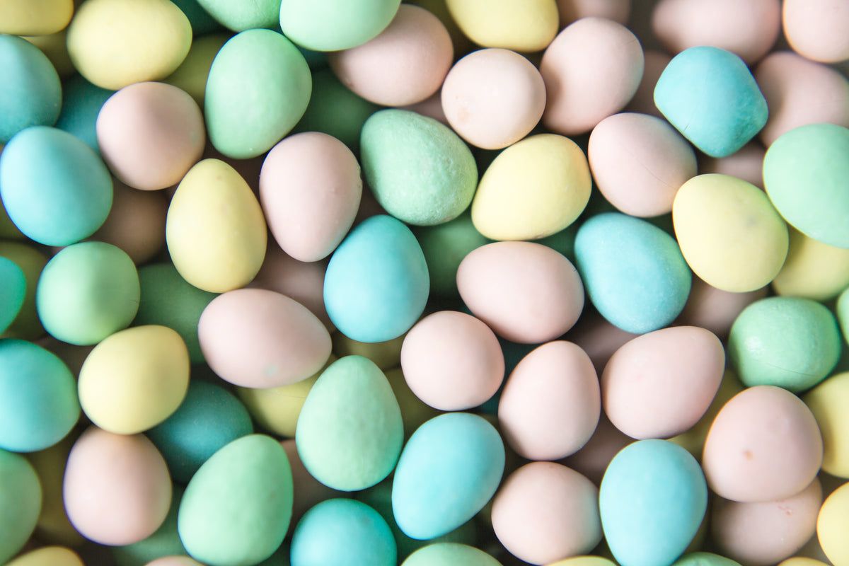 Pastel colored Easter eggs in a pile. - Egg