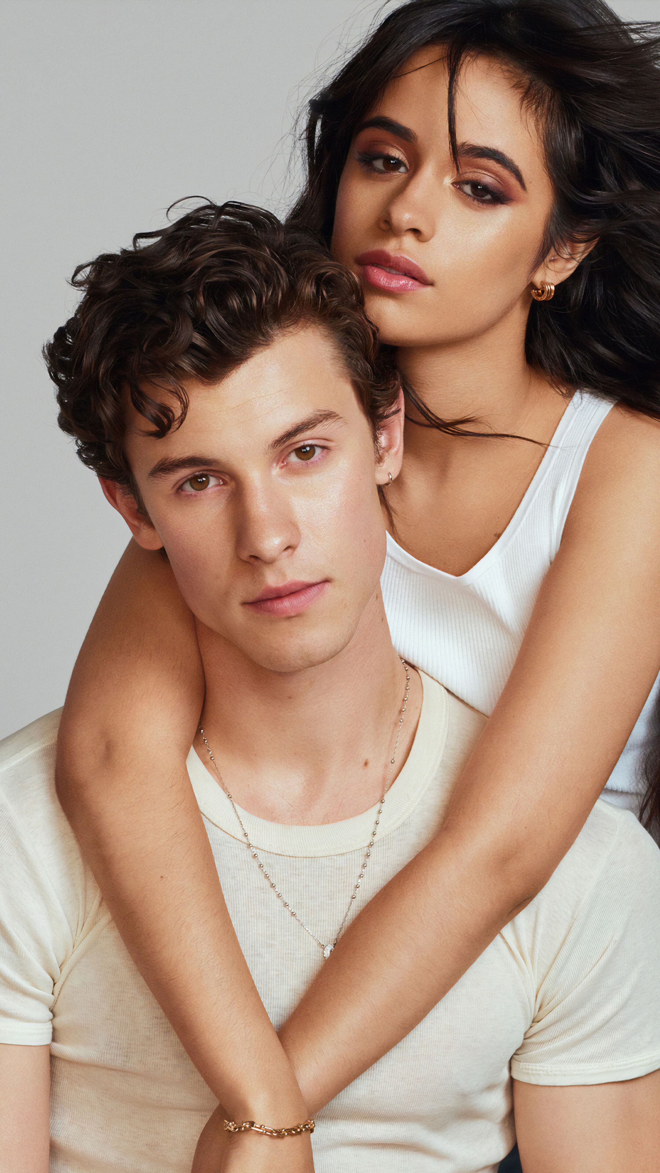 A man and woman posing for the camera - Shawn Mendes