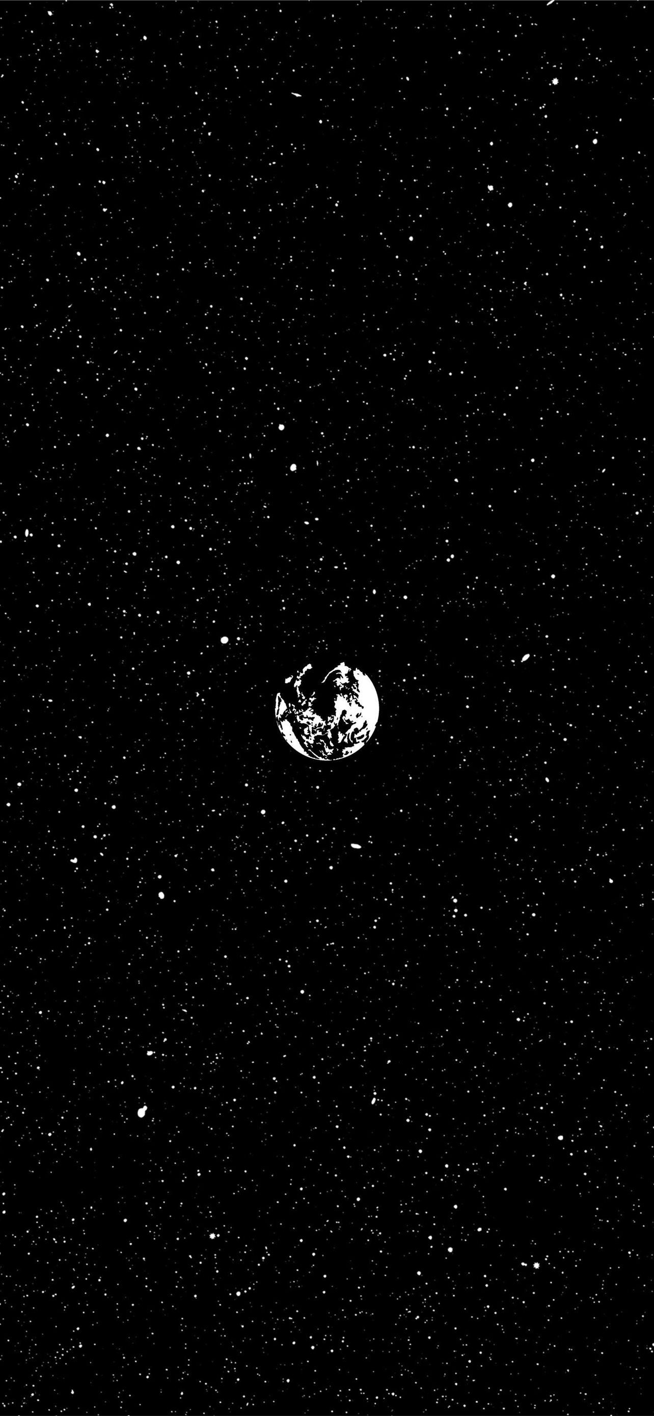 A black and white photo of the earth surrounded by stars - Venus