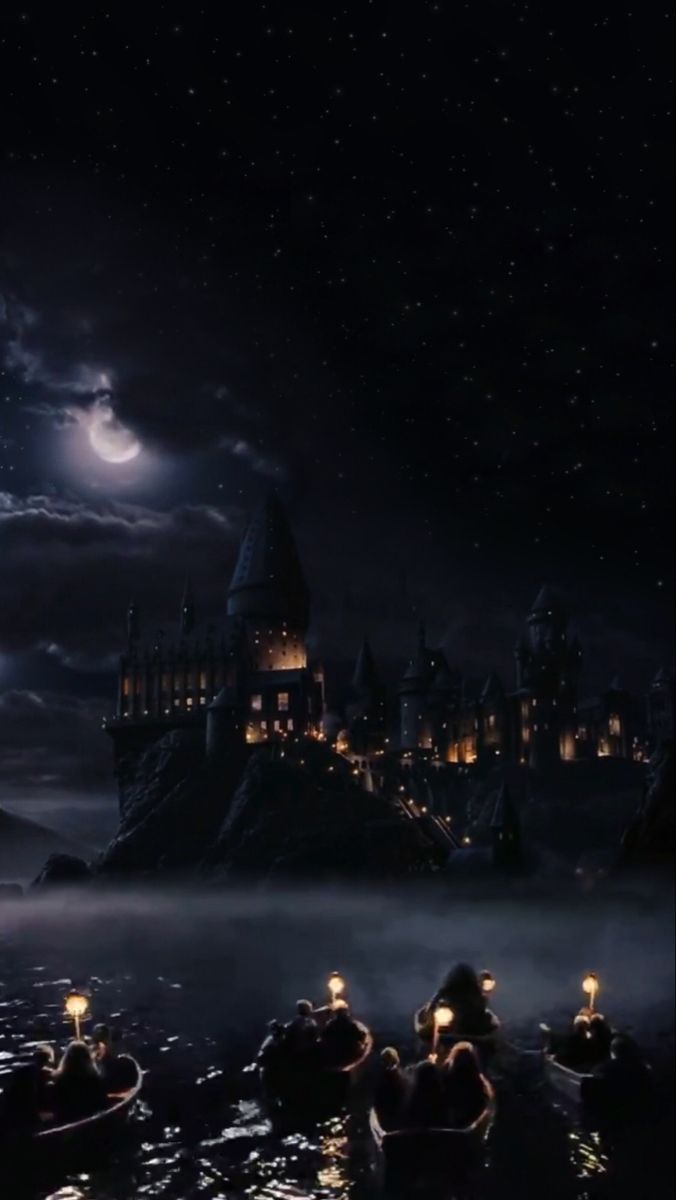 Hogwarts castle at night with full moon in the sky - Hogwarts