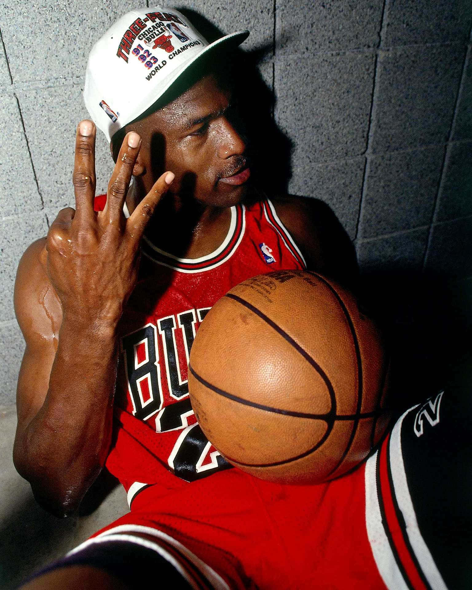 Download Get One Of The Greatest Athletes Of All Time On Your Phone With The Michael Jordan IPhone Wallpaper