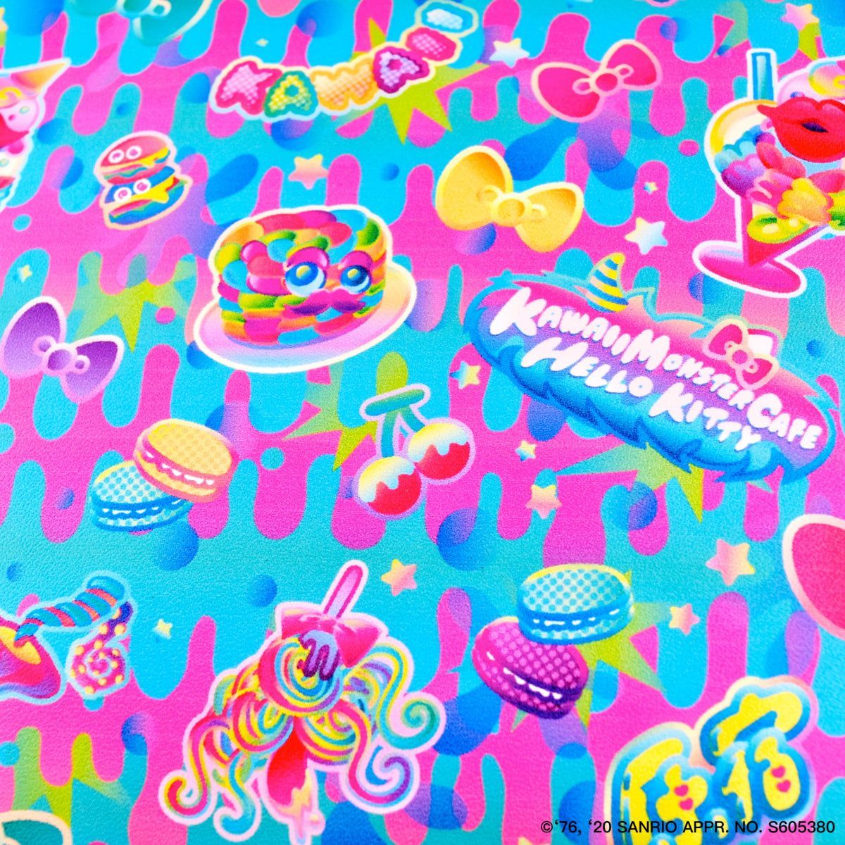 A close up of the fabric with Hello Kitty, Munchkins, and other Sanrio characters on it. - Kidcore
