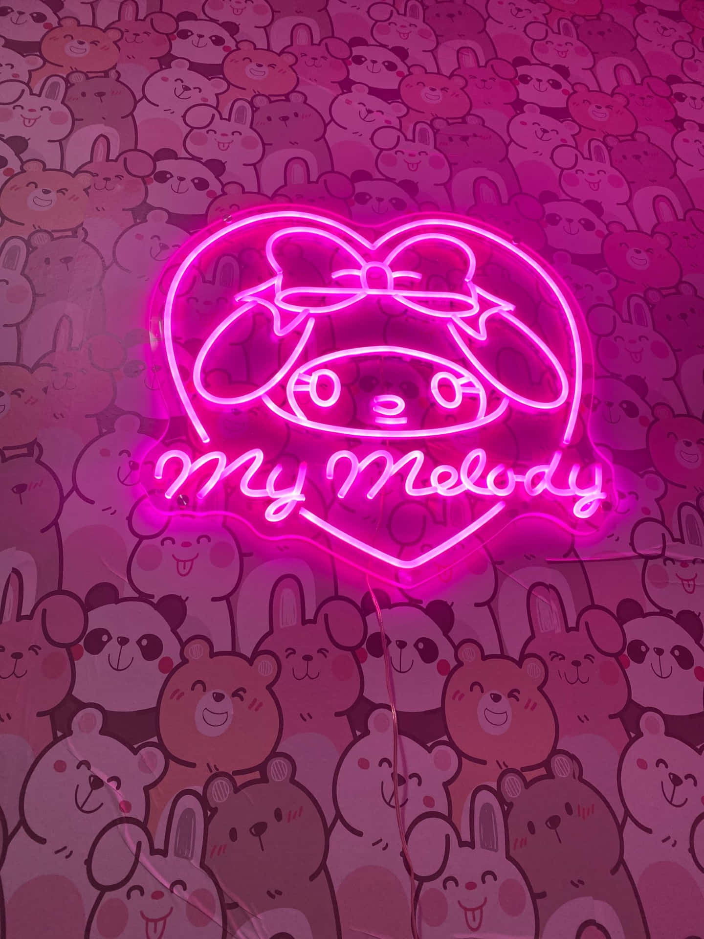 A pink neon sign of My Melody - My Melody
