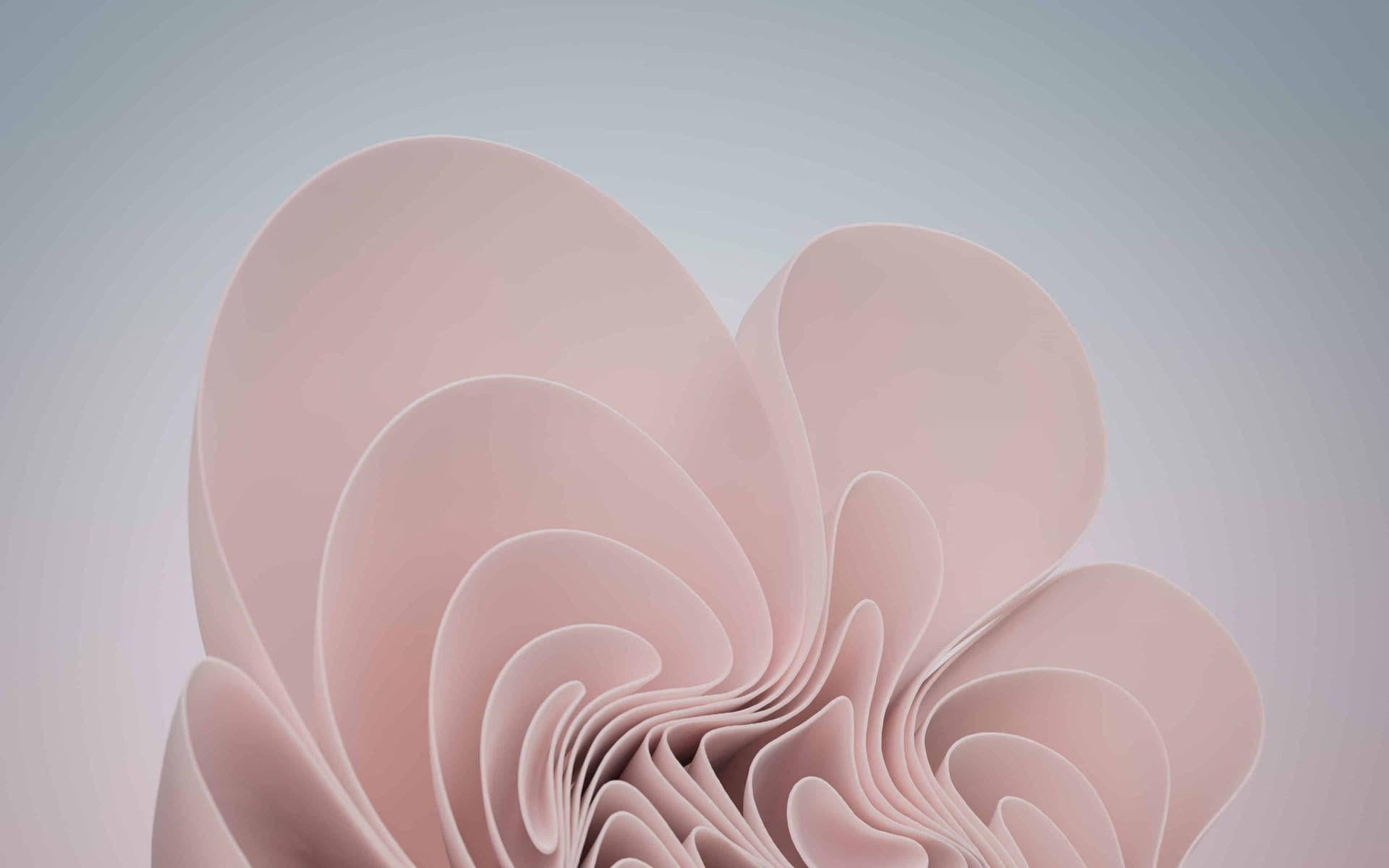 A pink abstract sculpture made of paper, resembling a flower. - Windows 11