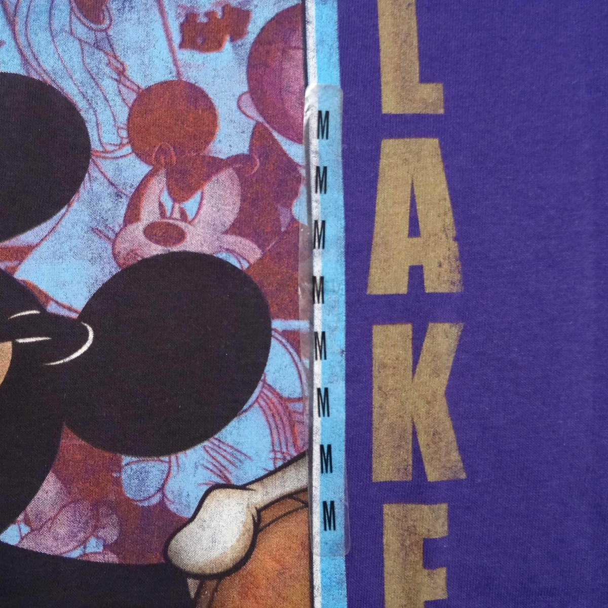 A purple shirt with a mickey mouse and the word lake on it - Los Angeles Lakers