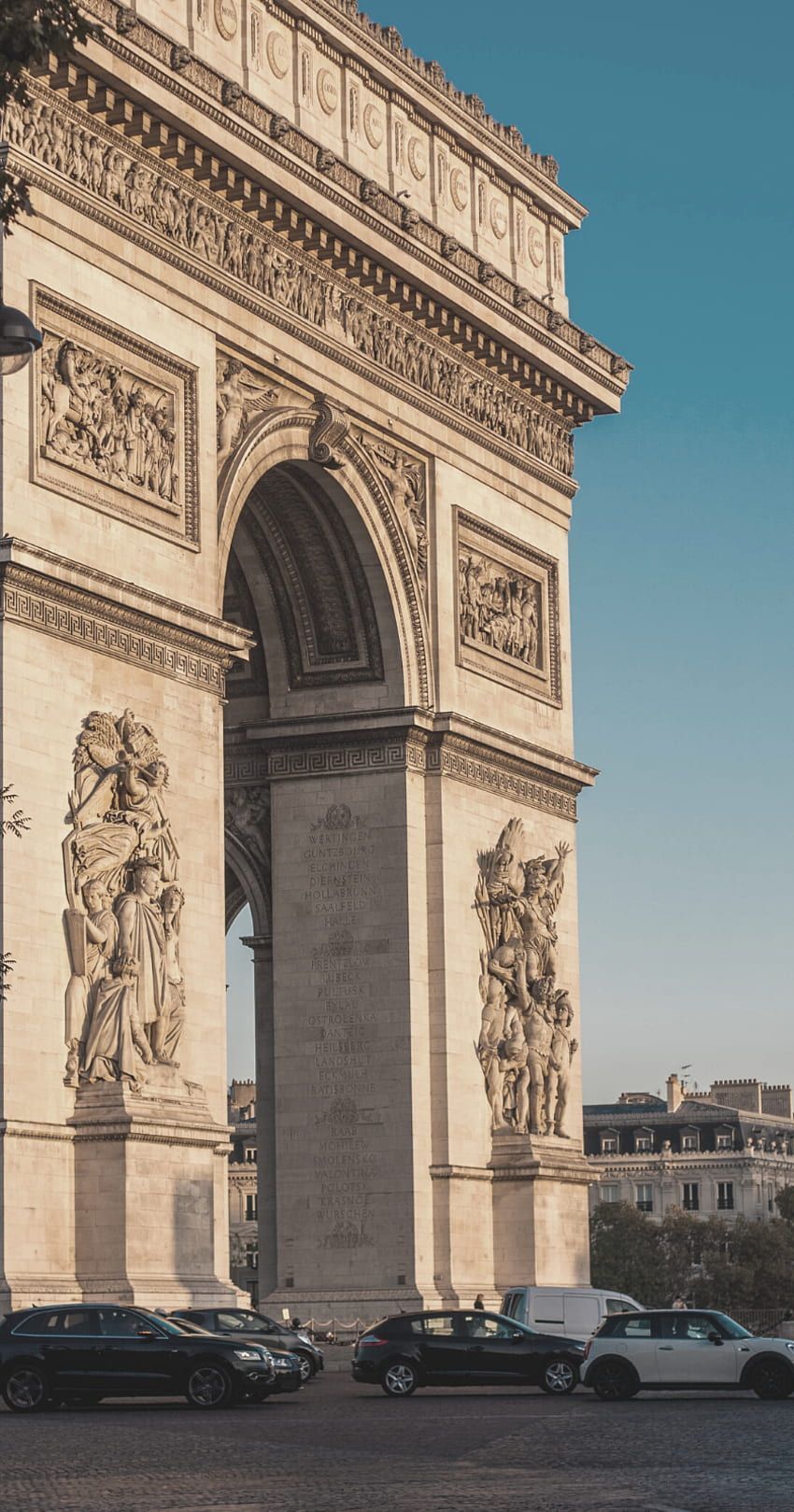 Arc de Triomphe in Paris, France, with cars driving on the road below. - France