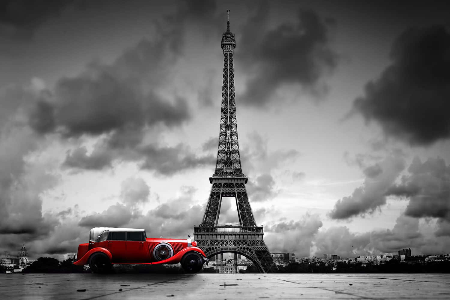 Red vintage car in front of the Eiffel Tower in Paris, France. Black and white with red car - France