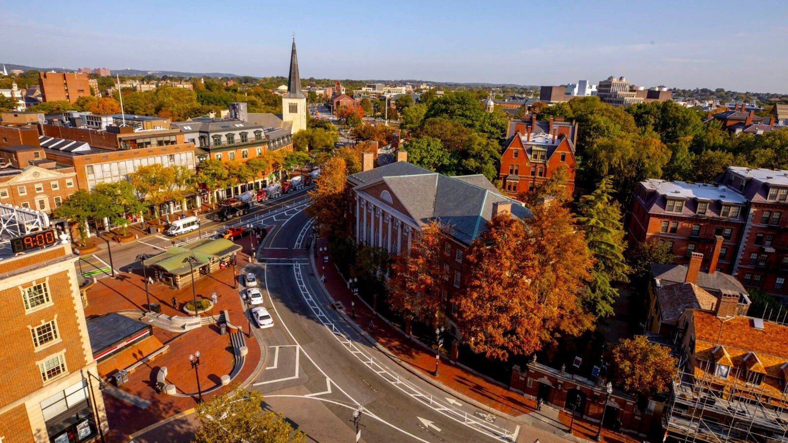 Aerial view of a city street with trees turning fall colors - Harvard