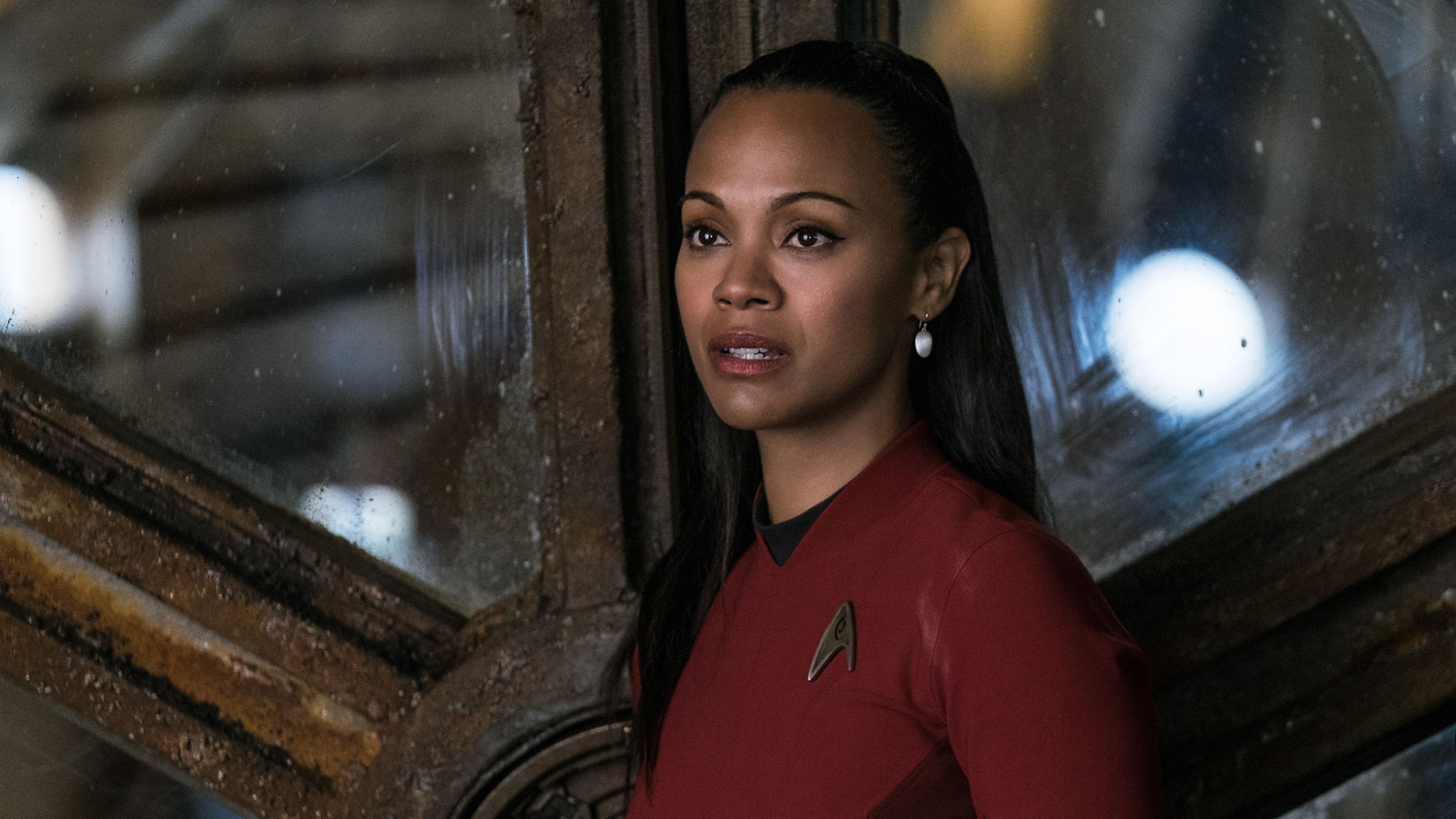 Zoe Saldana as Uhura in Star Trek Beyond. The crew of the USS Enterprise return to Earth to face a new threat, but they are forced to leave behind their old lives and embrace a new reality. - Star Trek
