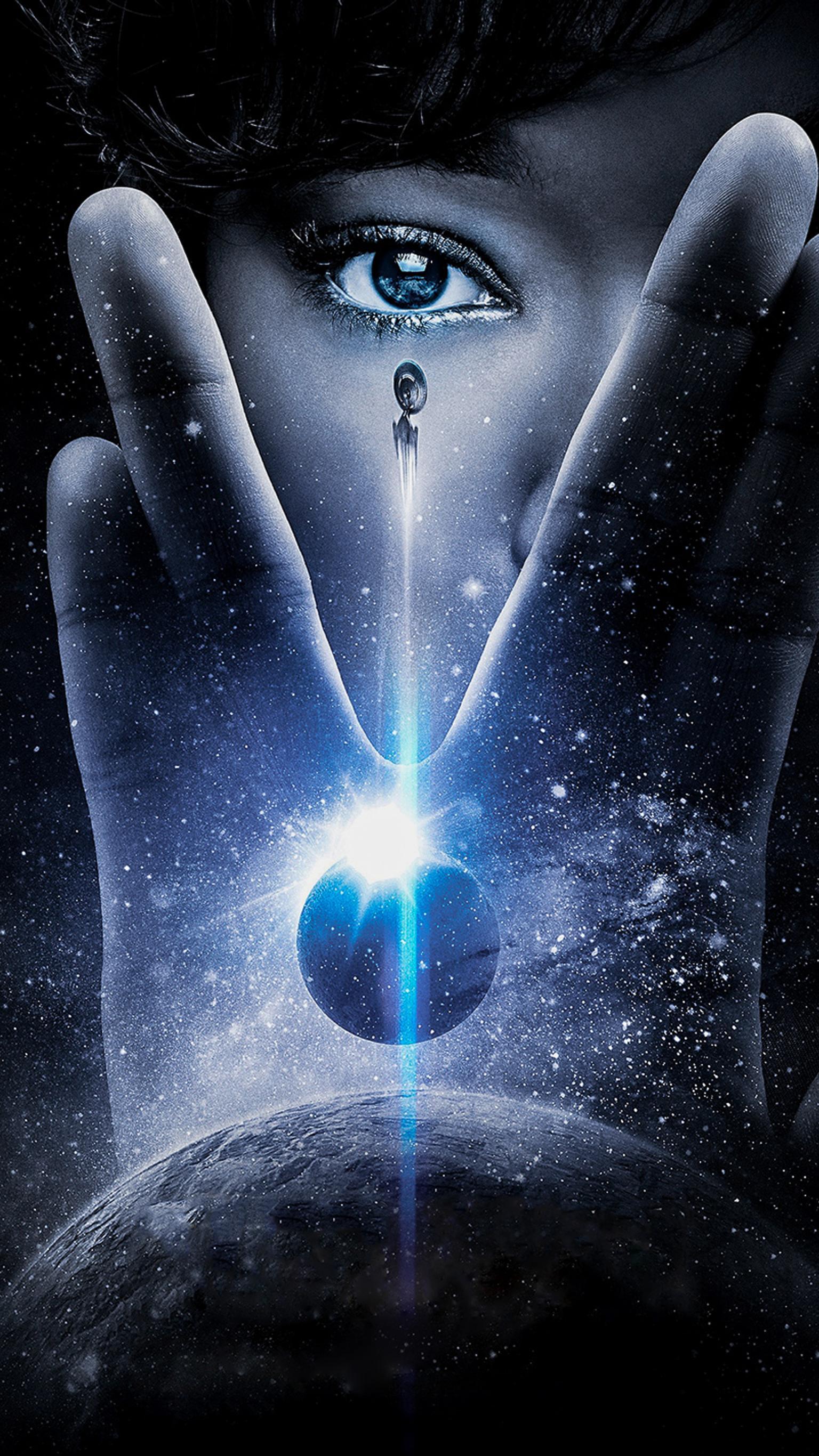 A Star Trek: Discovery poster with a hand holding a spaceship above a planet. - Star Trek