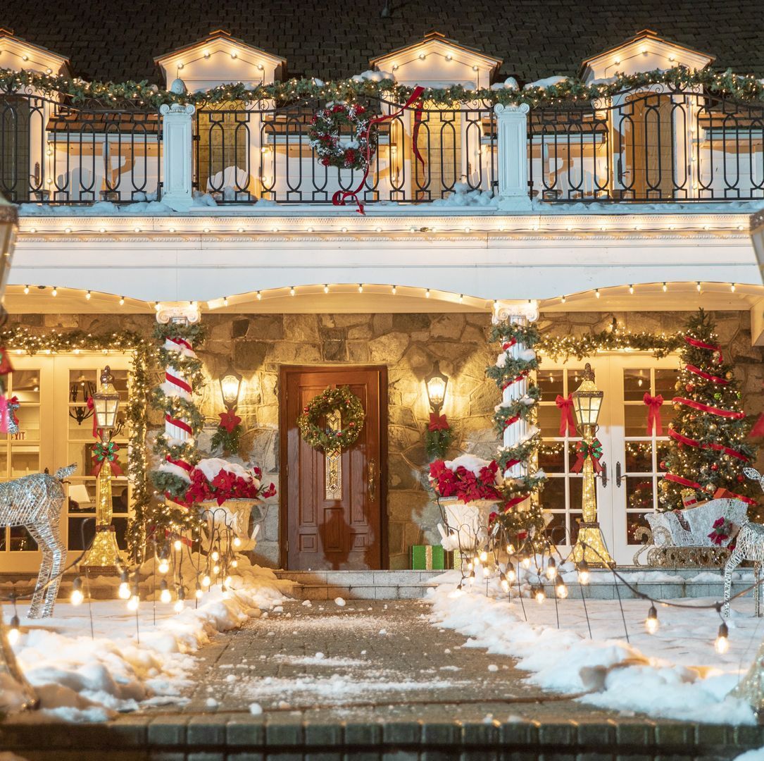 A house decorated with Christmas lights and decorations. - White Christmas