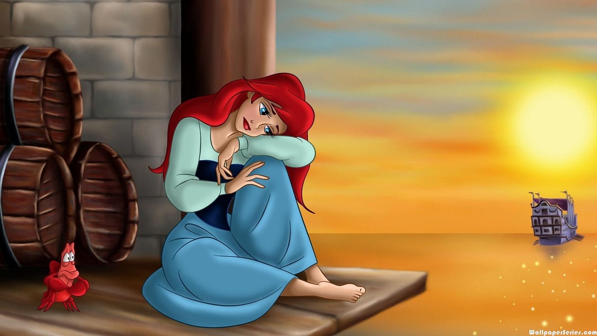 The little mermaid sitting on a barrel with her legs crossed - Ariel