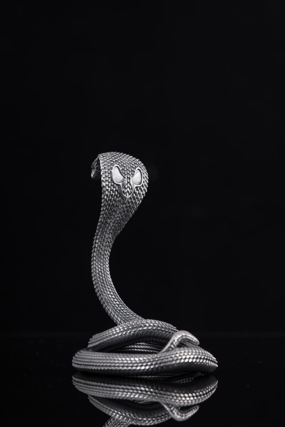 A snake statue sitting on top of a table photo