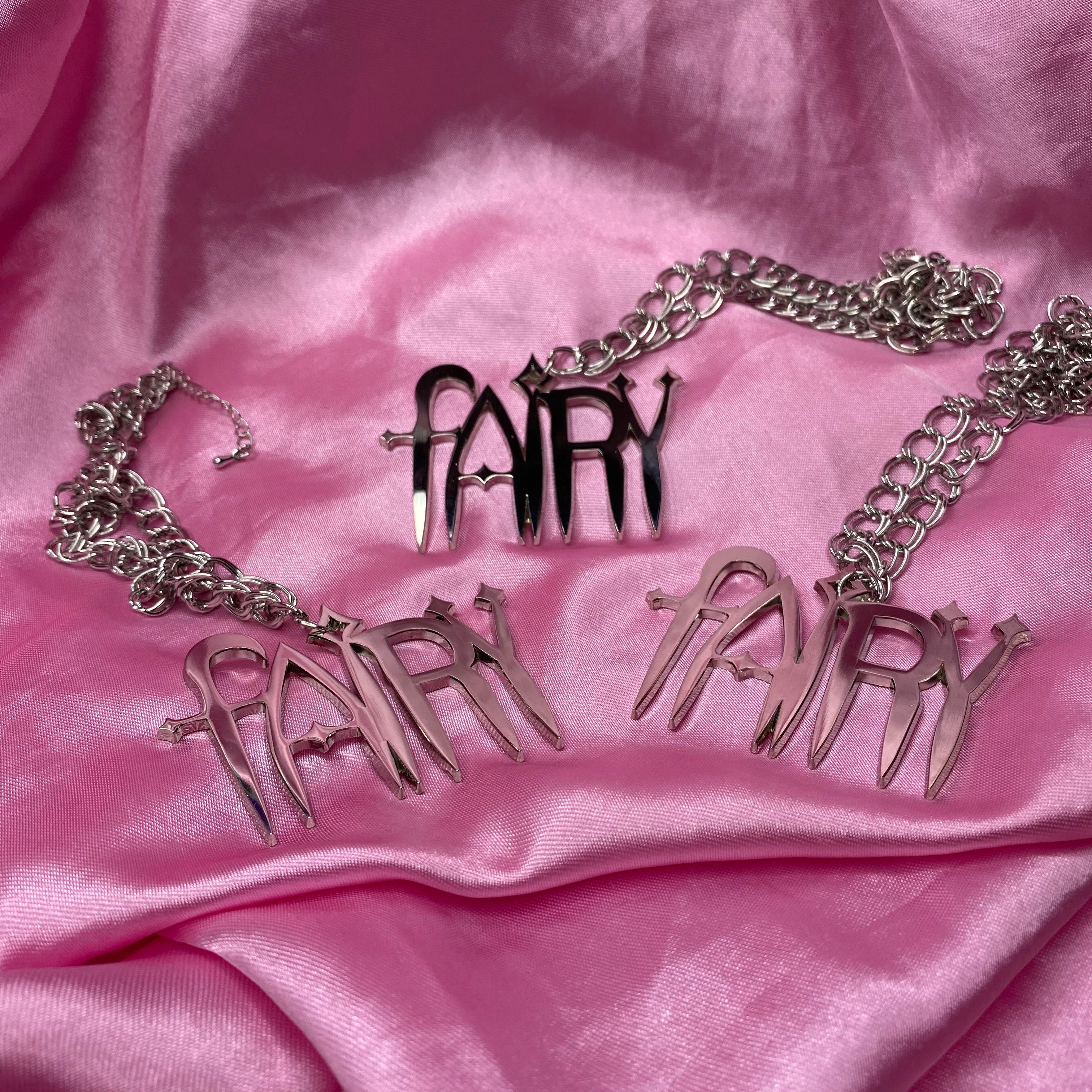 Two Fairy chains laying on a pink silk background - Rogue