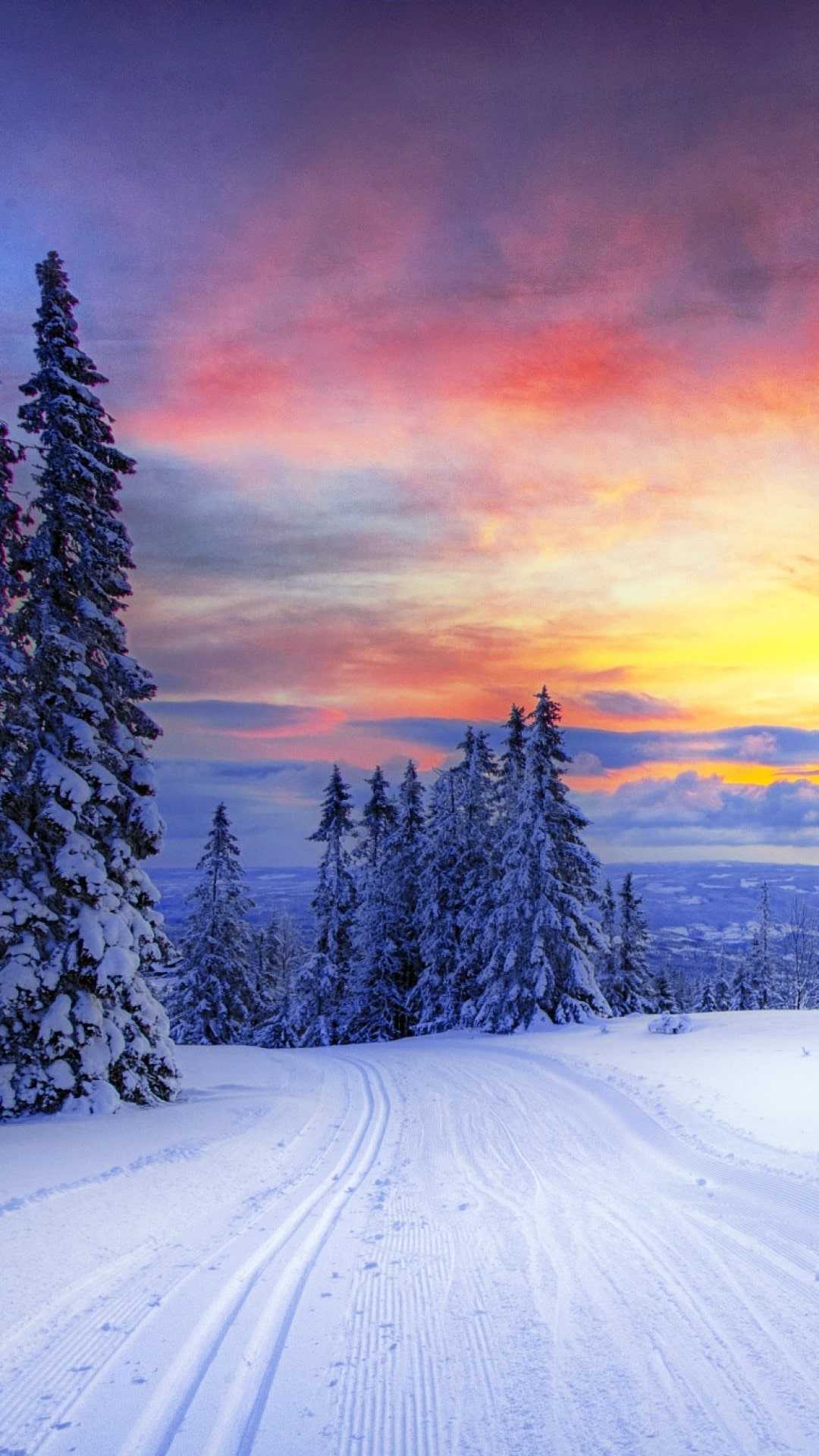 IPhone wallpaper with a beautiful sunset over a snowy landscape - Winter