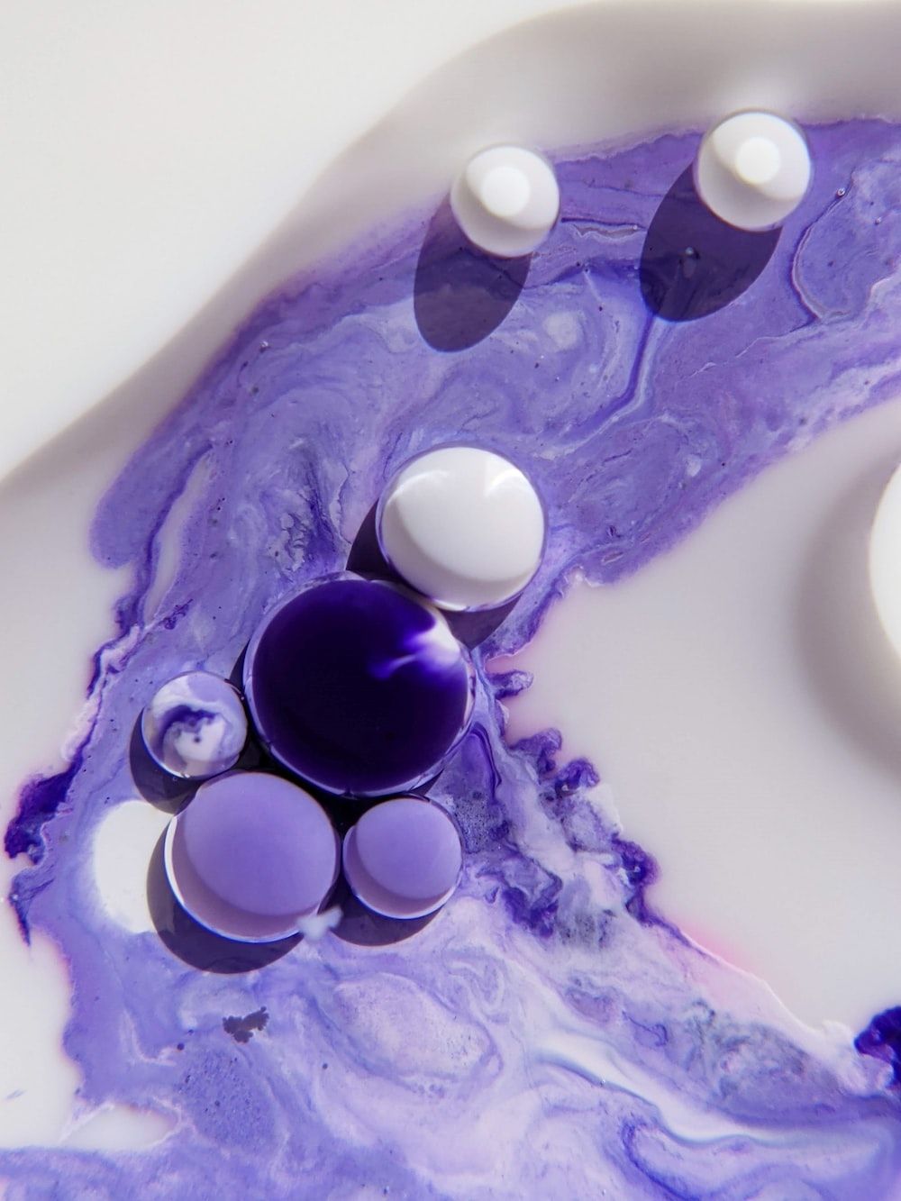 A close up of a purple and white object photo