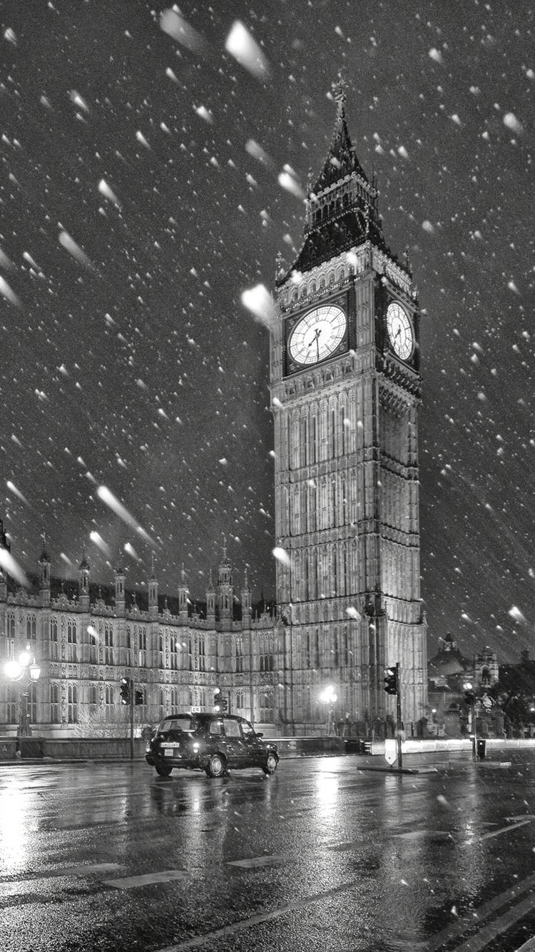 A black and white photo of Big Ben in the snow - London