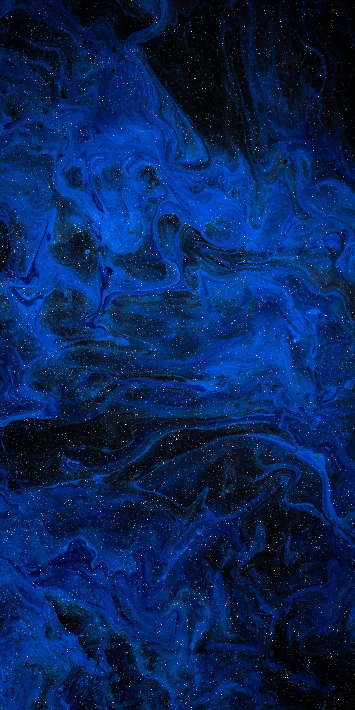 A blue liquid is flowing down the wall - Dark blue, abstract