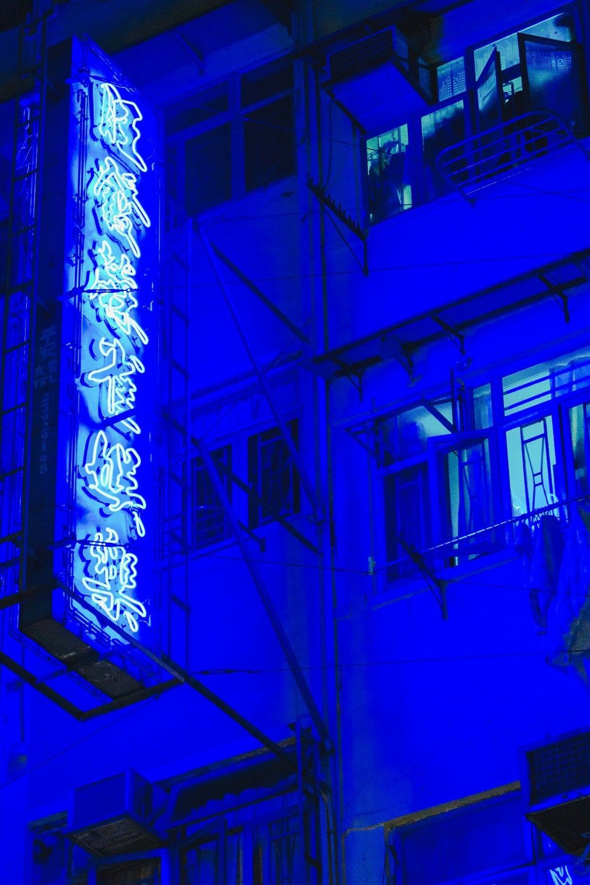 A building with blue neon lights on it - Dark blue