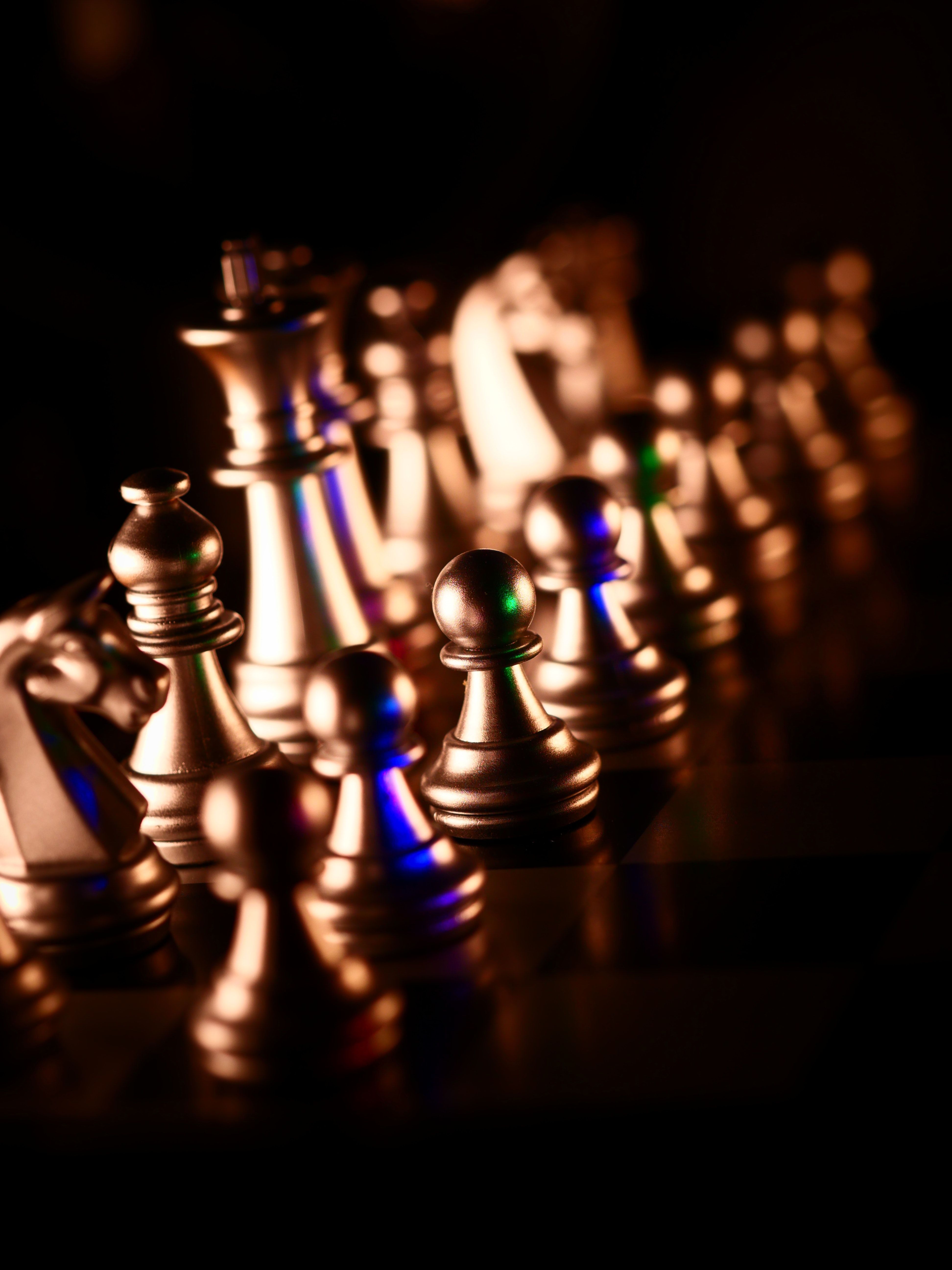 A chess board with silver chess pieces. - Chess