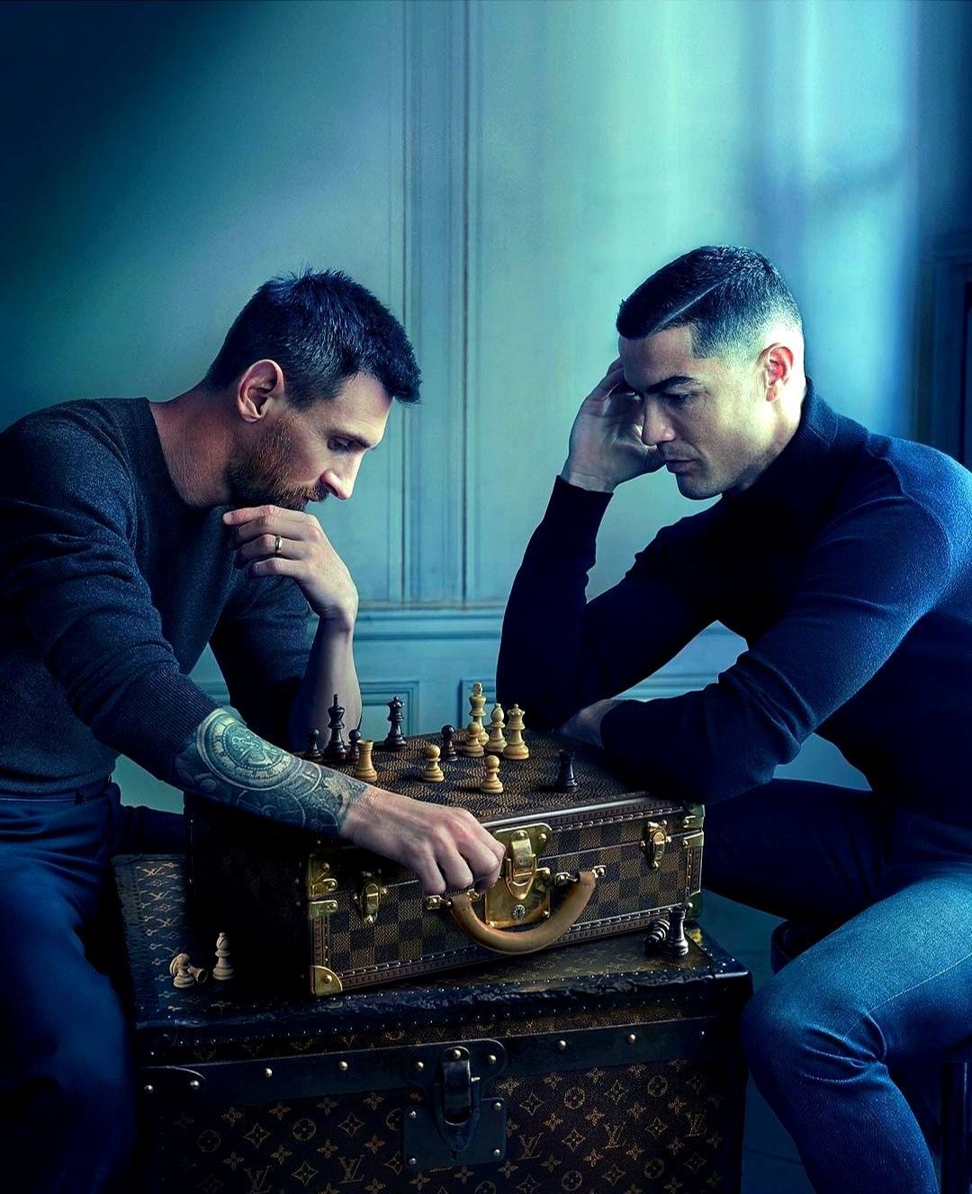 Two men playing chess on a Louis Vuitton trunk - Chess